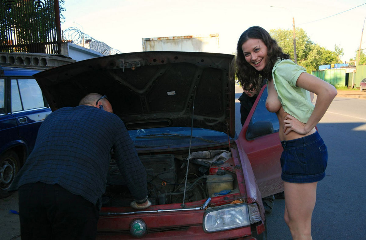 Girl fixing car