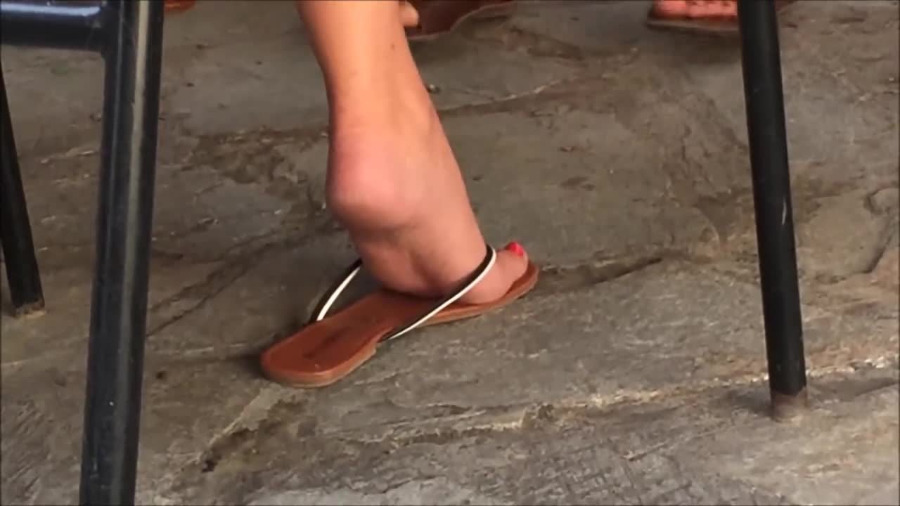 Black toes dangling flip flops