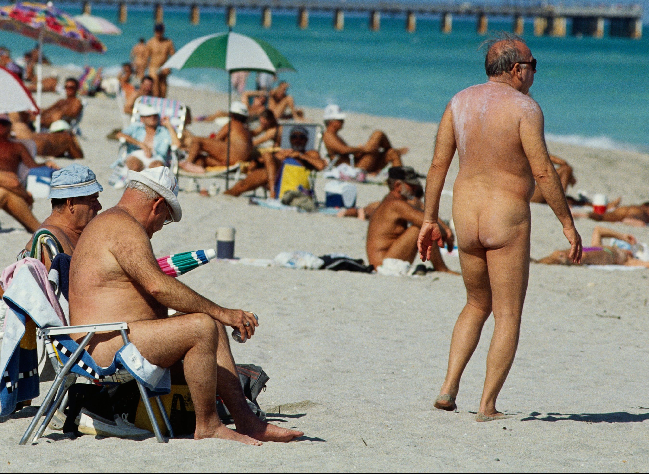 Nude couple caught nudist beach